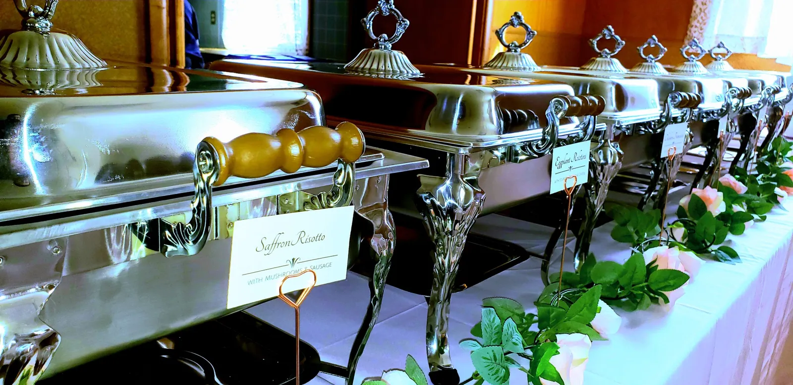 A Rosa's catering buffet set up in chafing dishes